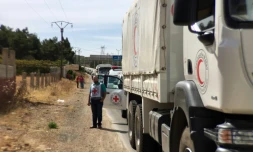 Photo fournie par la Croix-Rouge montrant un convoi humanitaire transportant de l'aide médicale près de la ville syrienne Zabadani (50 km de Damas), le 18 octobre 2015