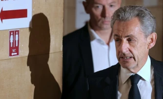 L'ancien président Nicolas Sarkozy arrive au palais de justice de Paris, le 7 avril 2026, pour son procès en appel dans l'affaire d'un financement libyen présumé de sa campagne présidentielle de 2007