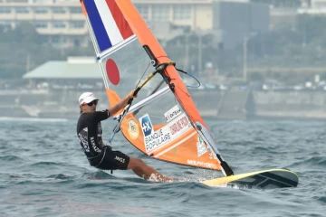 La française française Charline Picon, lors d'une compétition test de planche à voile (RS:X) en vue des jeux Olympiques de Tokyo, le 21 août 2019 au large de Enoshima dans la préfecture de Kanagawa