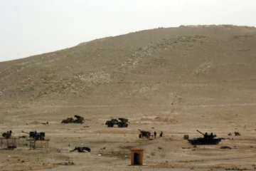 Des troupes syriennes déployées dans la ville syrienne de Palmyre le 24 mars 2016 
