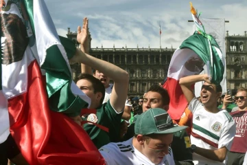 Mexico fans gathered in the capital's main Zocalo square erupt as their team defeated Germany at the World Cup