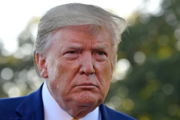 Donald Trump répond à la presse sur la pelouse de la Maison Blanche, le 11 octobre 2019 à Washington