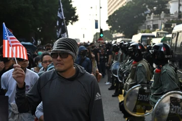 Marche organisée dans le quartier de Tsim Sha Tsui à Hong Kong le 1er décembre 2019 dans le cadre des mouvements de protestations pro-démocratie 