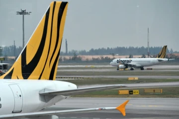 Un Airbus A320 de la compagnie singapourienne  Tigerair sur le tarmac de l'aéroport international Changi le 12 novembre 2015 à  Singapour 