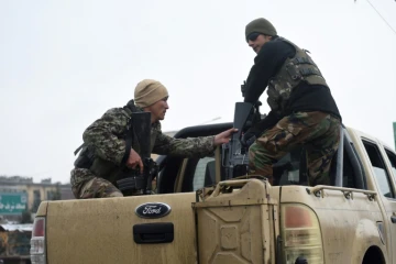 Des membres des forces de sécurité près de l'Académie militaire de Kaboul où s'est déroulé une attaque meurtrière le 29 janvier 2018