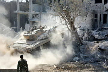 Les forces pro-gouvernementales syriennes progressent dans le district de Qaboun, à la périphérie de la capitale Damas, le 13 mai 2017