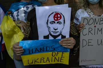 Ukrainian citizens take part in a protest in support of Ukraine in front of the Russian Embassy in Santiago, Chile, on February 26, 2022