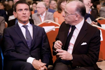 Le Premier ministre Manuel Valls (g) et le ministre de l'Intérieur Bernard Cazeneuve, le 8 septembre 2016 à Paris