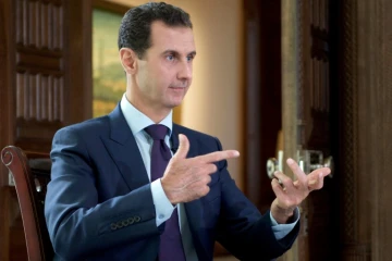 Photo du président syrien Bachar al-Assad pendant une interview à la chaîne danoise TV2, fournie par l'agence officielle syrienne Syrian Arab News Agency (SANA) le 6 octobre 2016