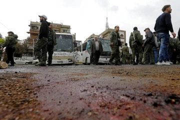 Sur le site d'un attentat, le 11 mars 2017 à Damas, en Syrie