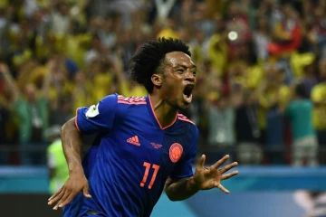 Le Colombien Juan Cuadrado fête un but contre la Pologne lors du Mondial, le 24 juin 2018 à Kazan
