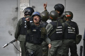 Des membres de la Garde nationale bolivarienne déployés après le soulèvement de militaires, à Caracas, le 21 janvier 2019.