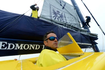 Les skippers français  Franck Cammas et Charles Caudrelier à bord du "Maxi Edmond de Rothschild", le 18 juillet 2019 au large de Lorient 
