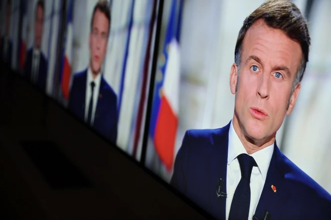 Capture d'écran du président français Emmanuel Macron lors de ses voeux pour le Nouvel An depuis le palais de l'Elysée, Paris, le 31 décembre 2024