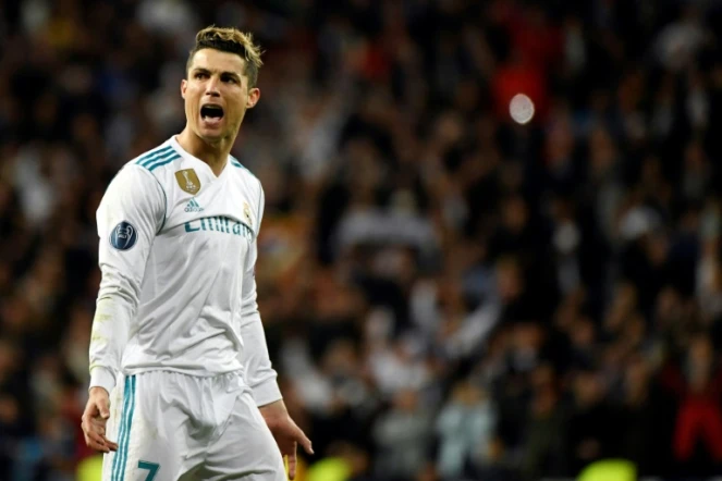 L'attaquant vedette du Real Madrid Cristiano Ronaldo exulte après avoir inscrit un but en quarts retour de C1 à Santiago Bernabeu, le 11 avril 2018   