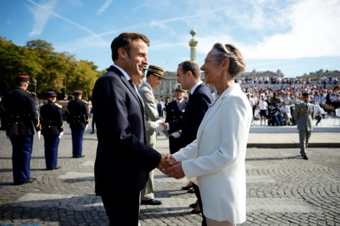 Le président Emmanuel Macron et la Première ministre Elisabeth Borne lors du défilé du 14 juillet sur les Champs Elysées à Paris