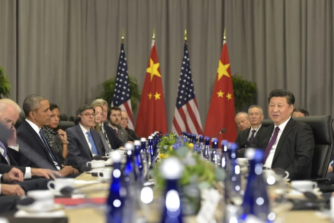 Le président américain Barack Obama (g) et le président chinois Xi Jinping(d) lors d'une rencontre bilatérale en marge du sommet sur la sécurité nucléaire à Washington le 31 mars 2016