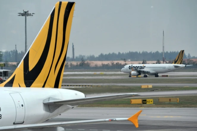 Un Airbus A320 de la compagnie singapourienne  Tigerair sur le tarmac de l'aéroport international Changi le 12 novembre 2015 à  Singapour 