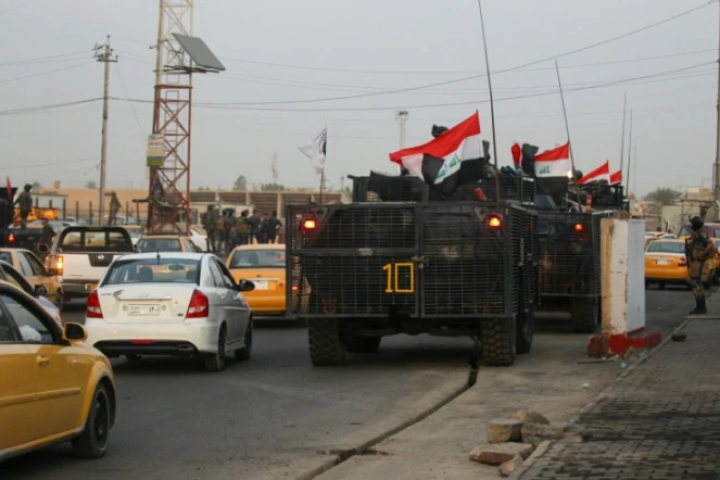 La police irakienne déployée dans une rue du quartier chiite de Sadr City, à Bagdad, le 7 octobre 2019