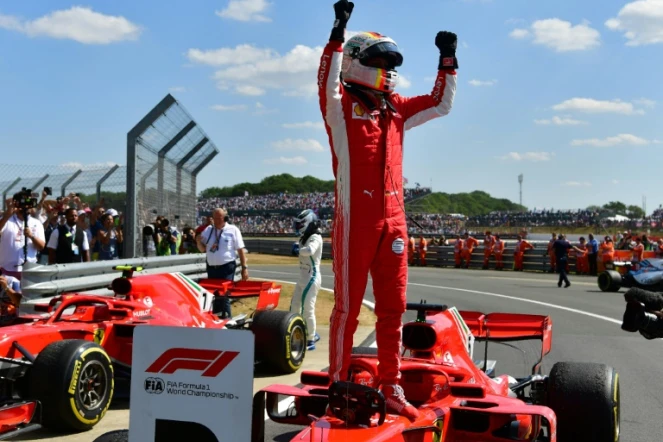 Sebastian Vettel juché sur sa Ferrari  après sa victoire dans le GP de Grande-Bretagne à Silverstone, le 8 juillet 2018