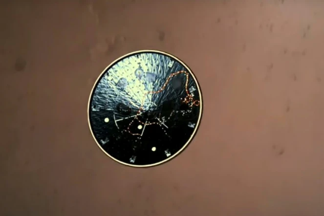 Image fournie par la Nasa du bouclier thermique largué au moment de l'atterrissage du rover américain Perseverance à la surface de Mars, le 18 janvier 2021