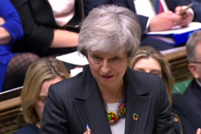 Capture écran d'une vidéo fournie par le Parlement britannique montrant la Première ministre Theresa May à la Chambre des Communes à Londres, le 12 février 2019 