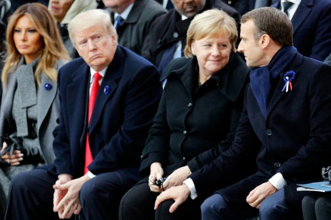 Le président américain Donald Trump, la chancelière allemande Angela Merkel et le président français Emmanuel Macron à Paris le 11 novembre 2018