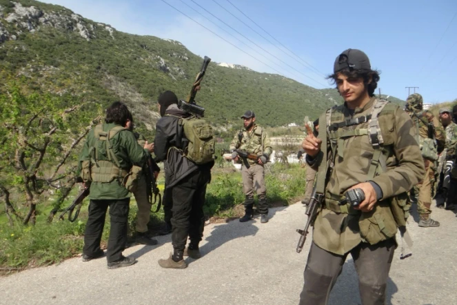 Un groupe de rebelles le 23 mars 2014  à Kassab en Syrie
