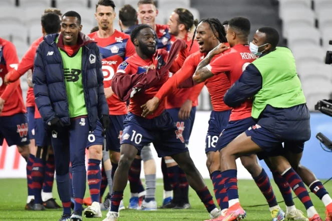 La joie des joueurs de Lille après leur victoire sur Lyon lors du match de Ligue 1 à Décines-Charpieu, le 25 avril 2021 