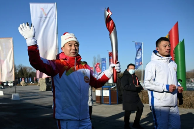 Le relais de la flamme olympique a débuté à Pékin le 2 février 2022, ici l'astronaute chinois Jing Haipeng