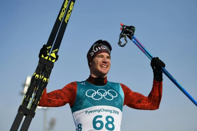 Le Suisse Dario Cologna savoure sa victoire sur le 15 km libre de ski de fond aux JO, le 16 février 2018 à Pyeongchang