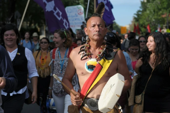 Des participants à une "marche festive" en ouverture du Forum Social Mondial, le 9 août 2016 à Montréal
