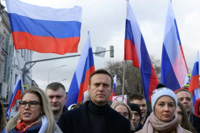 L'pposant russe Alexeï Navalny et son épouse Youlia participent à une marche en mémoire d'un détracteur du Kremlin à Moscou, le 29 février 2020