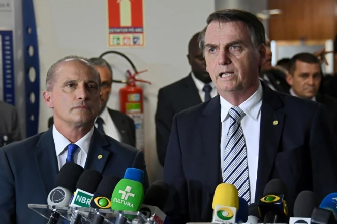 Le président élu Jair Bolsonaro (à droite) et son futur chef de cabinet Onyx Lorenzoni, le 20 novembre 2018 à Brasilia