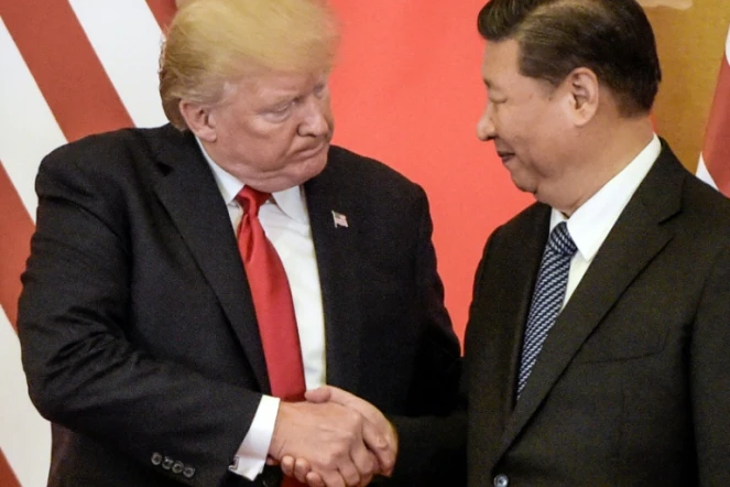 Donald Trump (G) et Xi Jinping à Pékin, le 9 novembre 2017