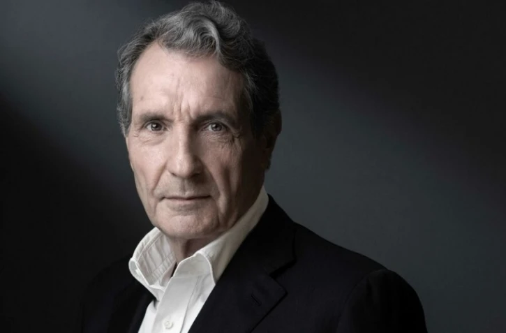 Une ancienne journaliste de RMC accuse Bourdin d?avoir tenté de l?embrasser dans la piscine d?un hôtel lors d?un voyage de presse à Calvi, en Corse, en 2013. AFP/JOEL SAGET