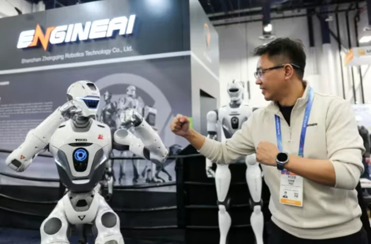 EngineAI founder Evan Yao says the China-based maker of humanoid robots is working with US tech titans such as Amazon and Meta on giving them AI brains ( AFP / Patrick T. Fallon )