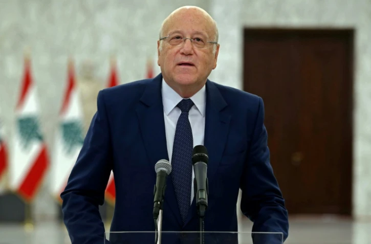 Photo fournie par l'agence Dalati & Nohra montrant le Premier ministre libanais désigné, Najib Mikati, au palais présidentiel de Baabda, le 26 juillet 2021