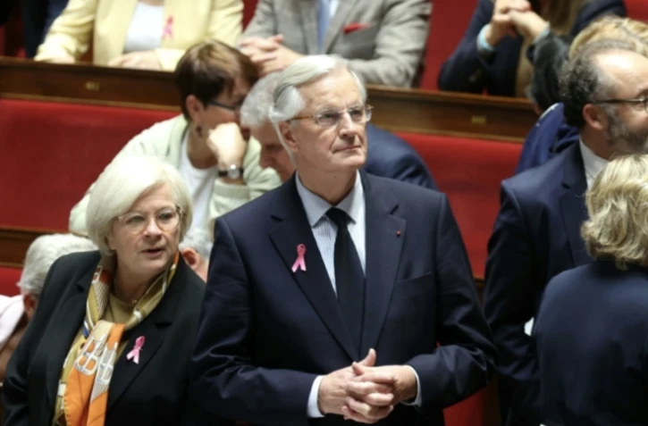 La ministre du Partenariat avec les territoires et de la Décentralisation Catherine Vautrin et le Premier ministre Michel Barnier à l'Assemblée nationale, le 1er octobre 2024 ( AFP / ALAIN JOCARD )