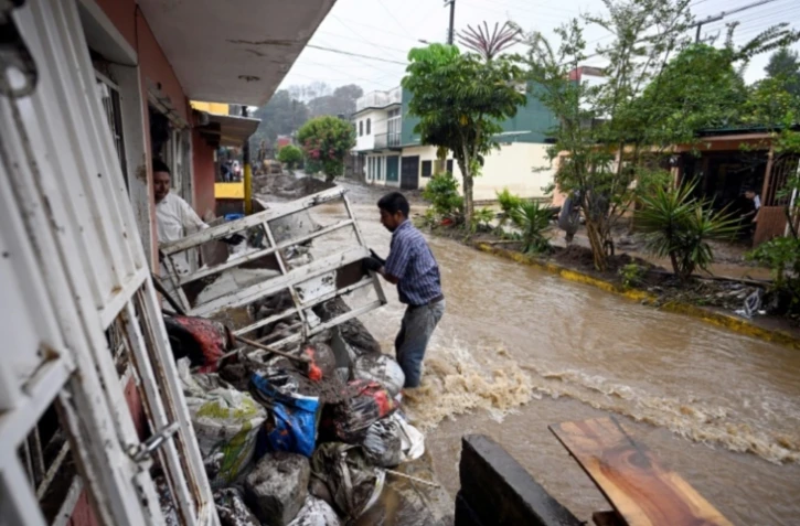 Inondations à Huauchinango, dans l'Etat mexicain de Puebla, le 11 octobre 2025 ( AFP / Alfredo ESTRELLA )