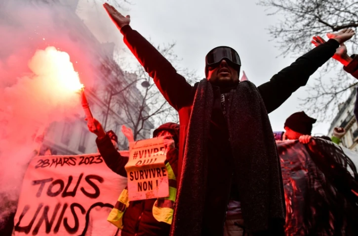 Des manifestants lors de la mobilisation contre la réforme des retraites à Paris, le 28 mars 2023