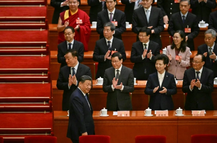 Le président chinois Xi Jinping arrive à la cérémonie d'ouverture de la Conférence consultative politique du peuple chinois (CCPPC) au Palais du peuple à Pékin, le 4 mars 2025