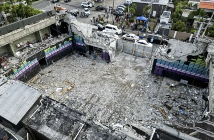 Vue aérienne des ruines de la discothèque Jet Set, dont l'effondrement du toit a fait plus de 200 morts, le 11 avril 2025 à Saint-Domingue, en République dominicaine ( AFP / MARTIN BERNETTI )