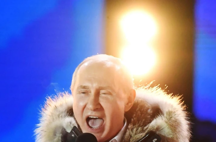 Le président russe Vladimir Poutine lors d'un rassemblement et un concert à Moscou pour le 4e anniversaire de l'annexion de la Crimée, le 18 mars 2018