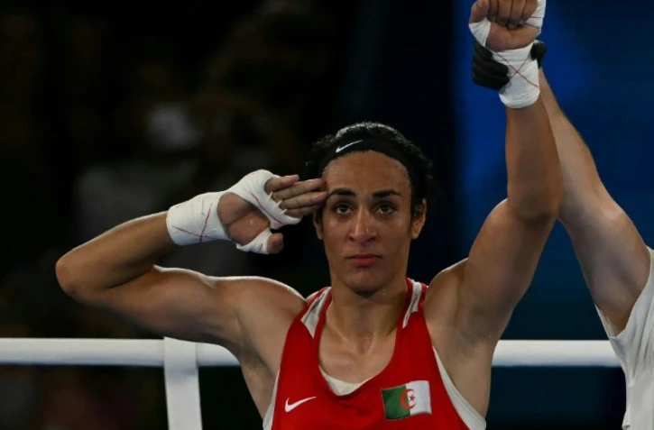   L'Algérienne Imane Khelif après sa victoire contre la Chinoise Yang Liu en finale olympique des -66kg à Paris, le 9 août 2024 AFP Mauro PIMENTEL