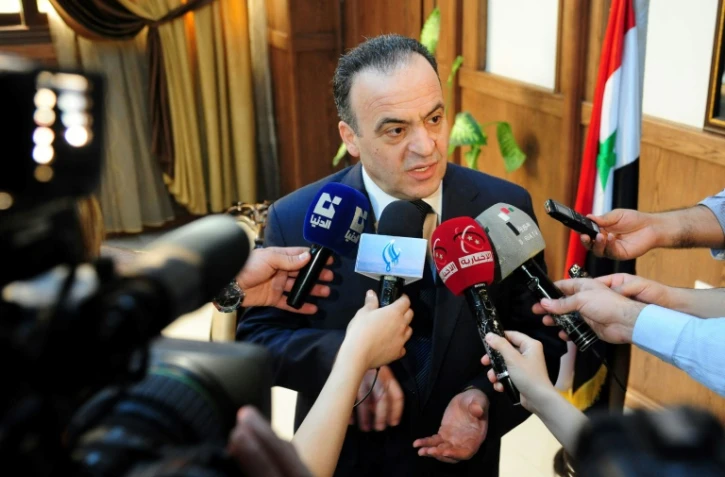 Une photo d'archives datant du 11 mai 2013 montre Imad Khamis, à l'époque ministre de l'Electricité, à Damas