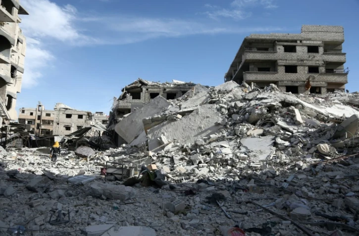 Photo de destructions dans la ville tenue par les rebelles de Saqba, dans la Ghouta orientale, cible de bombardements meurtriers du régime syrien, le 9 mars 2018