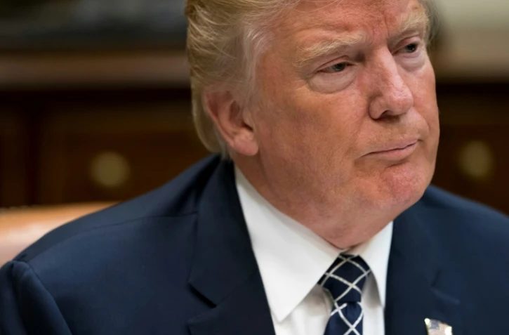 Le président américain Donald Trump lors d'un déjeuner avec des membres de l'armée américaine à la Maison Blanche, à Washington, le 18 juillet 2017 