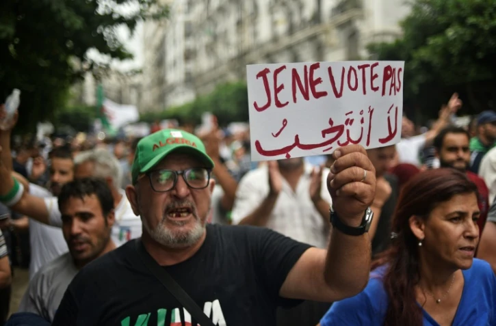 Des Algériens manifestent le 13 septembre 2019 à Alger pour s'opposer à la tenue d'une présidentielle organisée par le régime