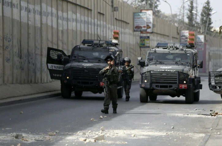 Des soldats israéliens lors de heurts avec des Palestiniens à al-Ram, entre Jérusalem et Ramallah, le 22 octobre 2015
